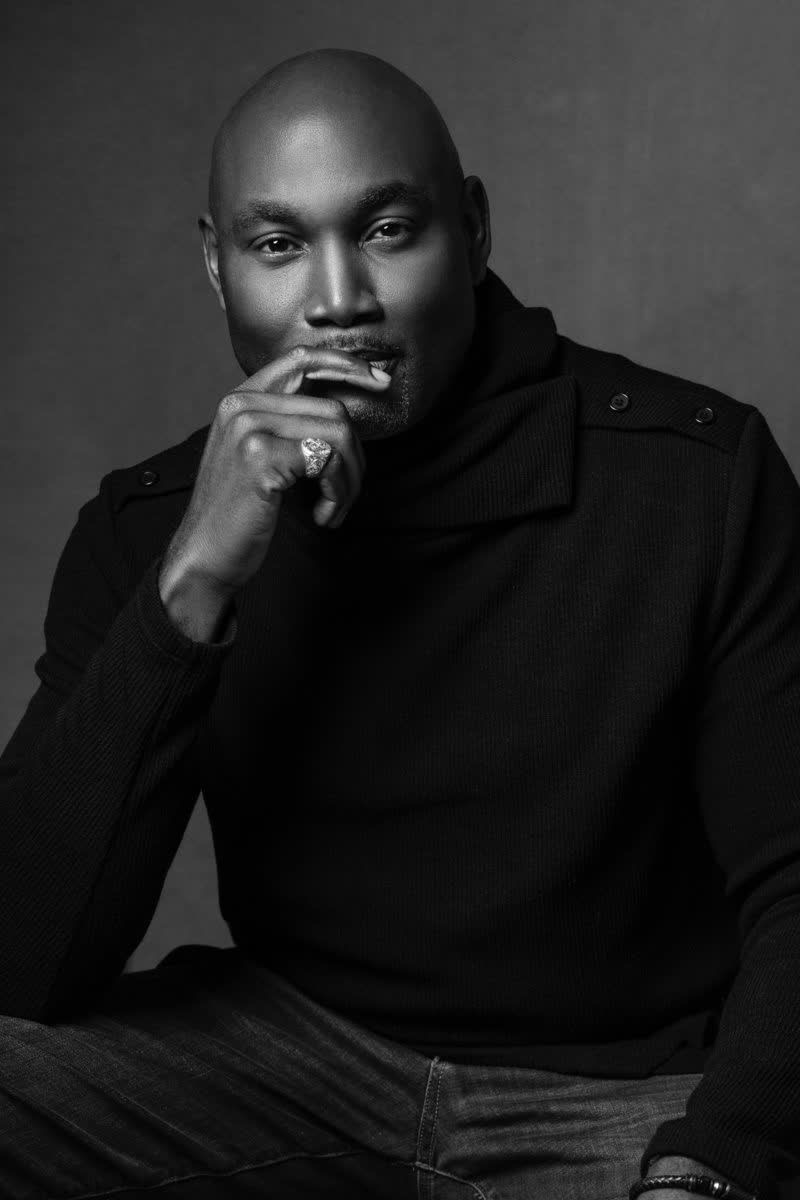 belief systems - image of man with hand under chin posing for a camera